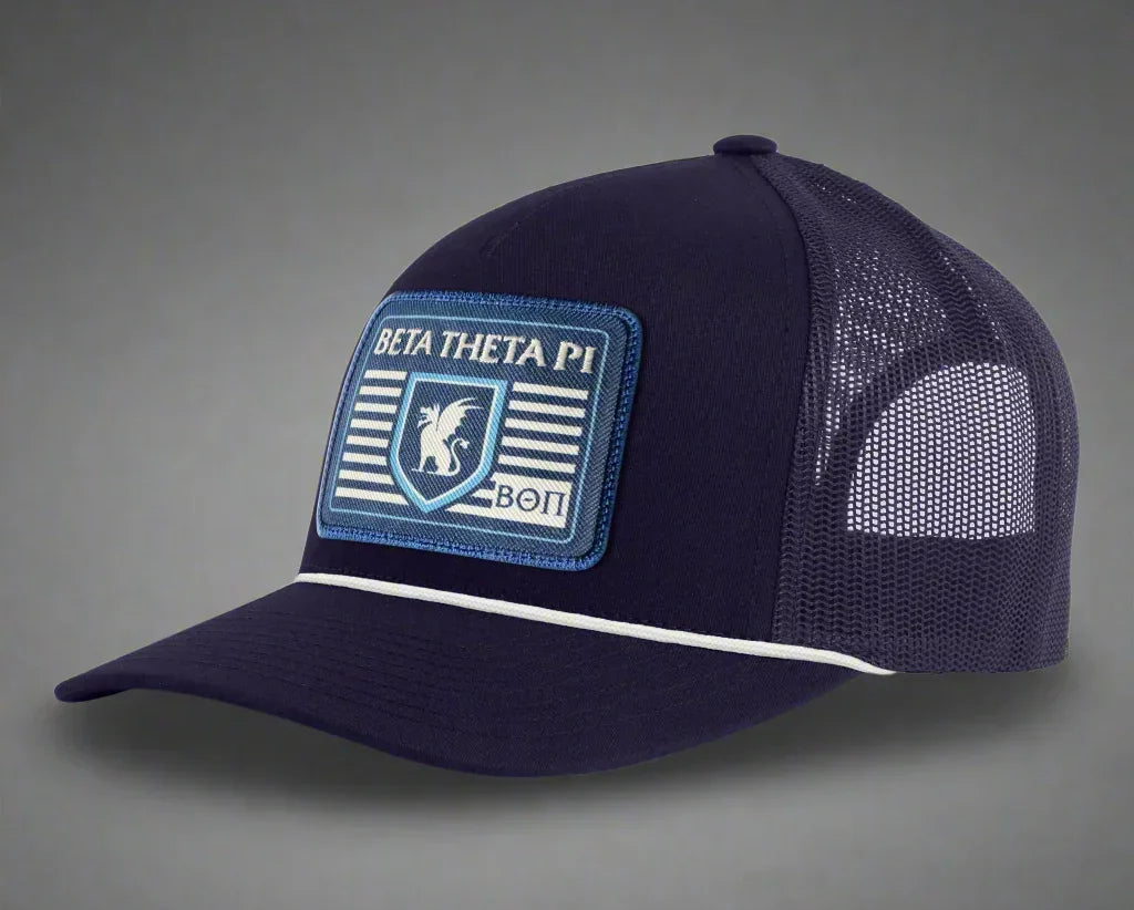 Navy blue Beta Theta Pi trucker hat with mesh back and embroidered crest patch