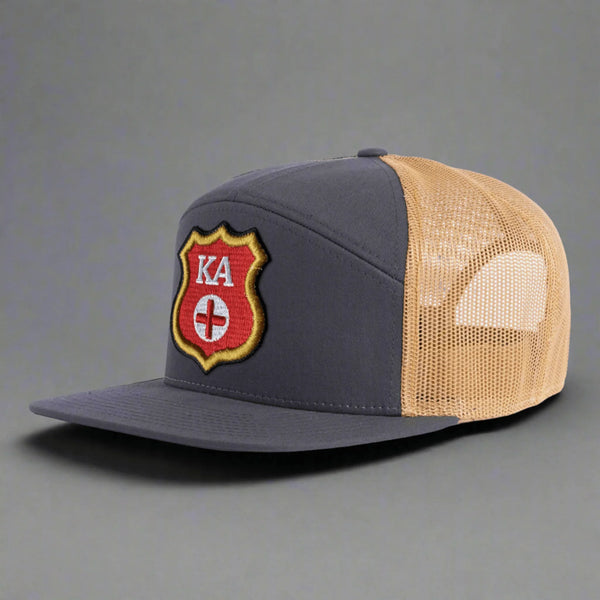 Gray and tan mesh trucker hat with KA red gold shield logo on front panel