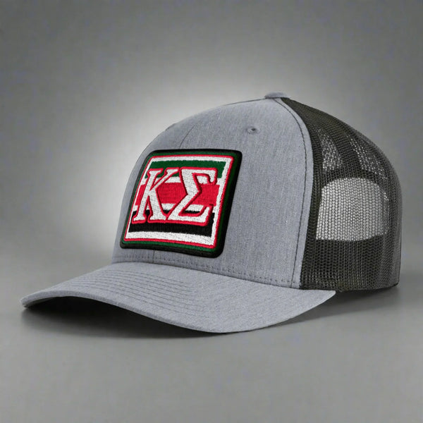 Gray mesh trucker hat with embroidered red, green, and white Kappa Sigma patch