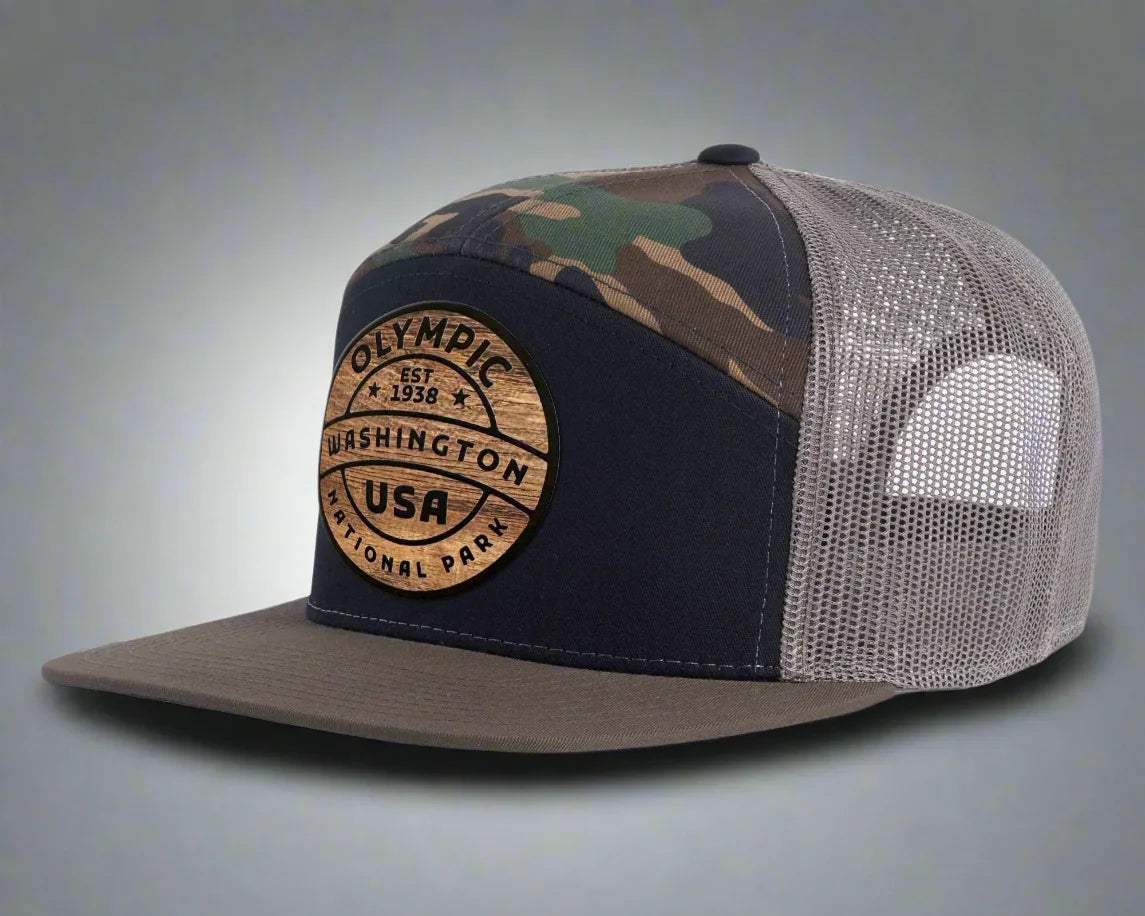 Olympic National Park trucker hat with black camo, mesh back, and wood patch logo