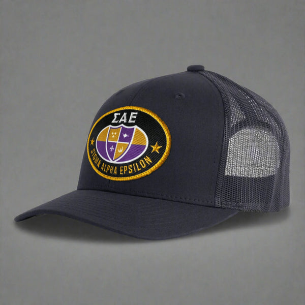 Black mesh trucker hat with Sigma Alpha Epsilon SAE crest patch on front
