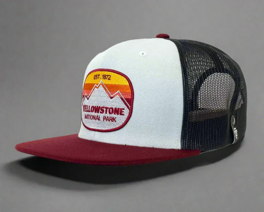 Yellowstone National Park trucker hat with mesh back, red bill, and mountain patch