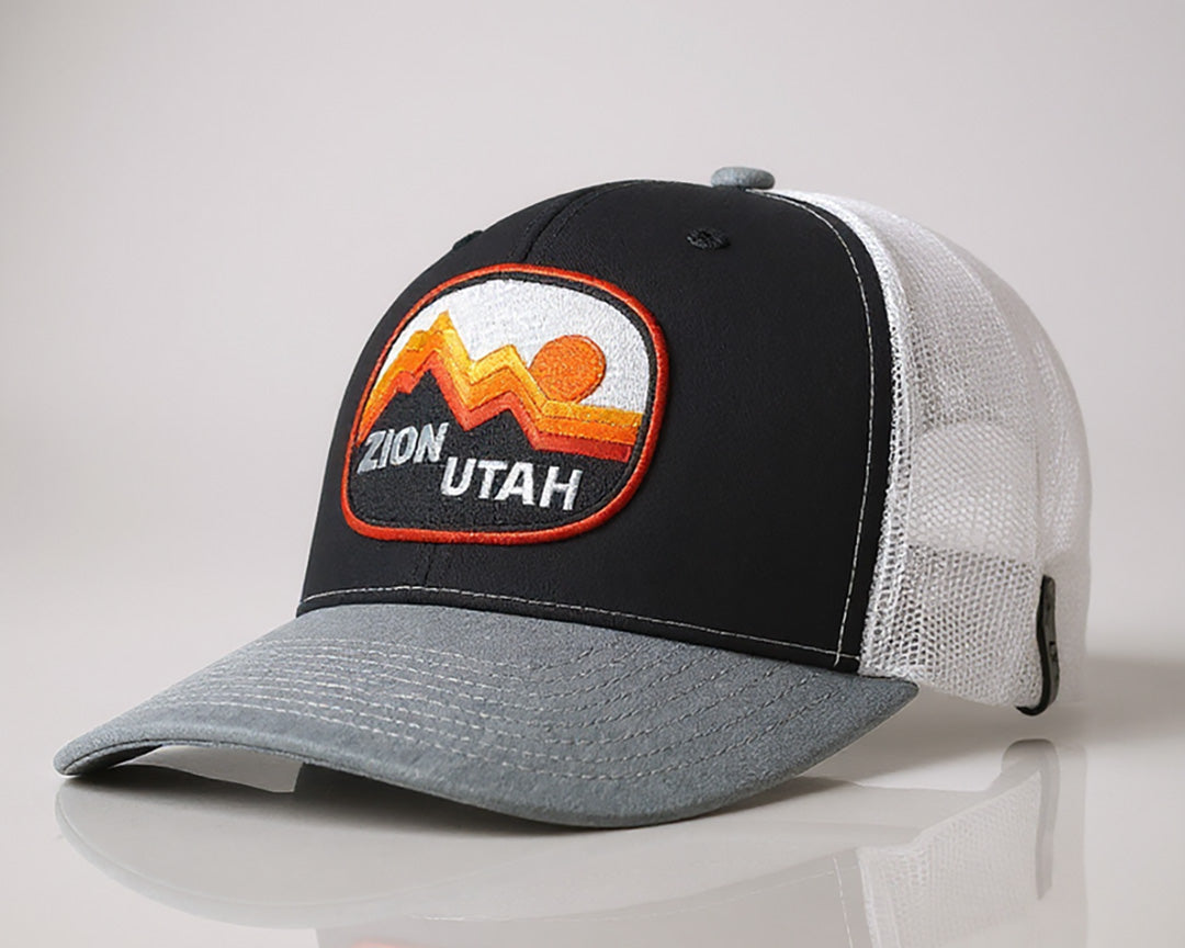 Orange and gray trucker hat with Bryce Canyon National Park patch on front