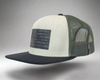 Trucker hat with black and white design on a gray background