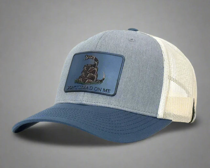 Blue and gray cap with a patch on a white background