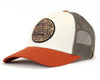Trucker hat with white front panel, orange bill, and mesh back on a white background