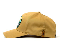 Beige baseball cap with a logo on the side on a white background