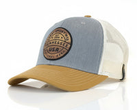 Trucker hat with a leather patch on a white background