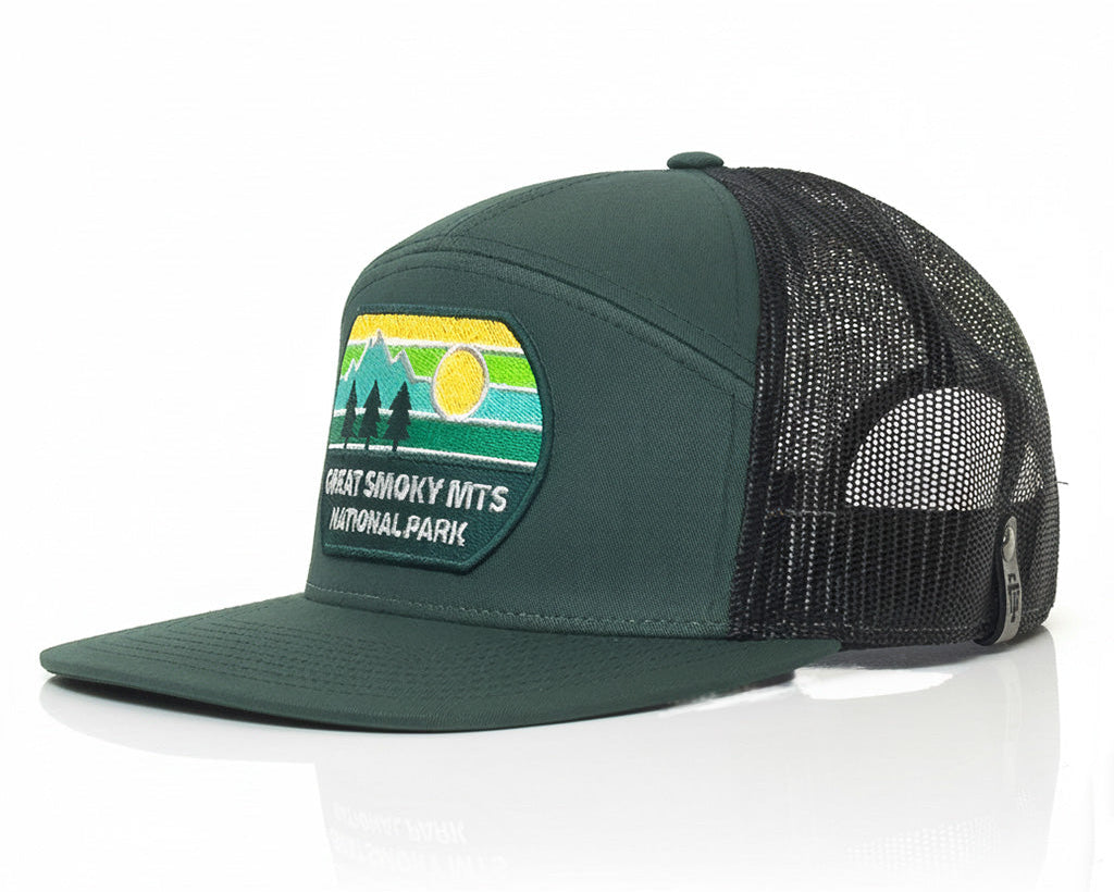 Green and black cap with a patch for Great Smoky Mountains National Park on a white background