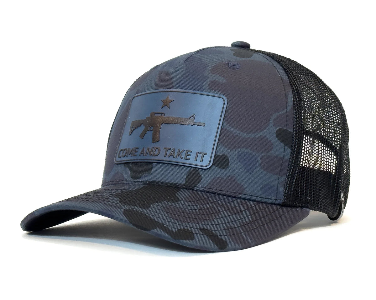 Camouflage baseball cap with 'Come and Take It' patch on a white background
