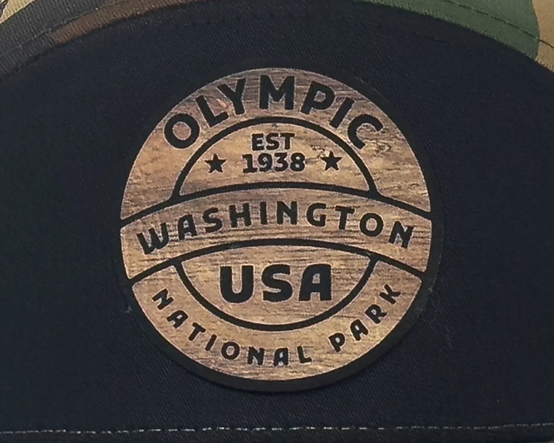 Cap with Olympic Washington USA National Park logo on a dark background