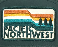 Patch with 'Pacific Northwest' text and landscape design on a green background