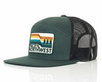 Green trucker cap with 'Pacific Northwest' logo on a white background