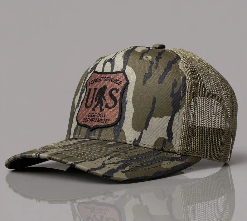 Camouflage cap with a patch on a gray background