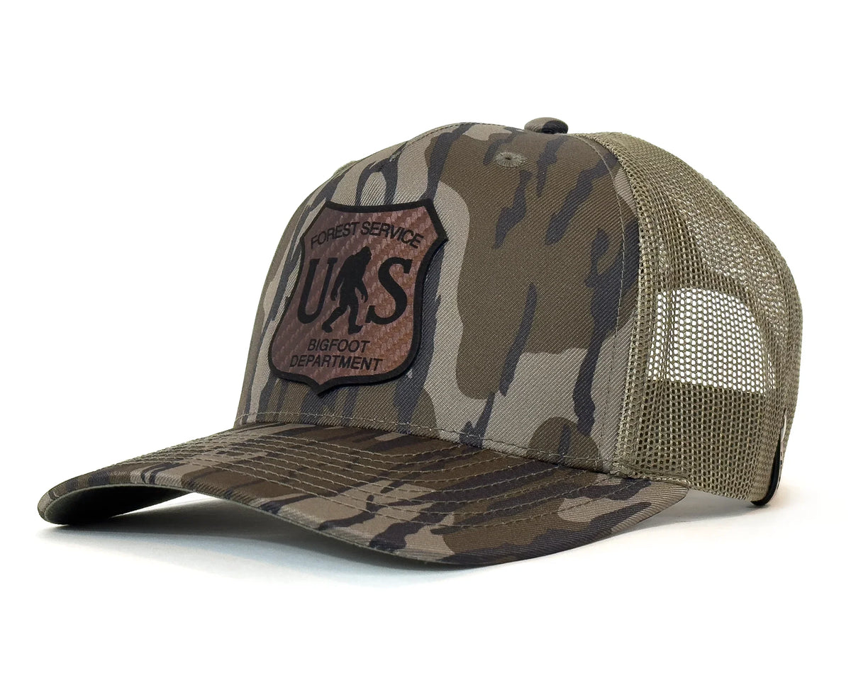 Camouflage cap with a patch on a white background