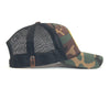 Camo green and black mesh trucker hat with side logo and curved brim on white background