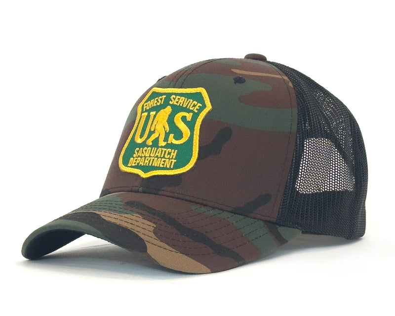 Camouflage cap with a yellow and green logo on a white background