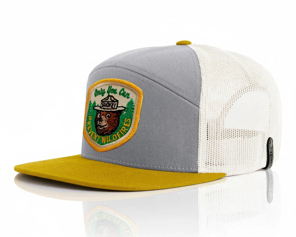 Gray and yellow cap with a patch on a white background