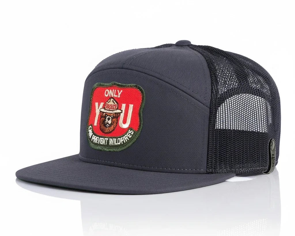 Black mesh cap with a red and green patch on a white background
