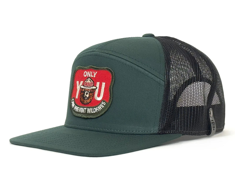 Green trucker hat with a red and black patch on a white background