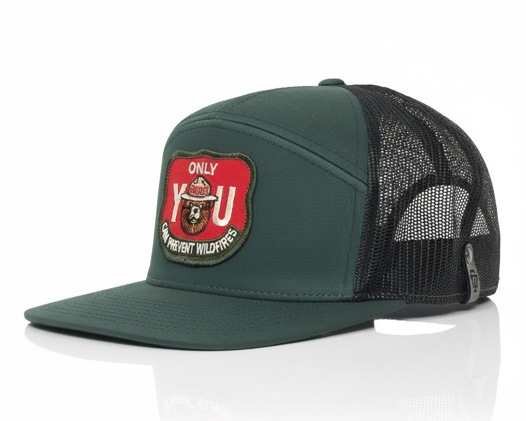 Green cap with a red and black patch on a white background