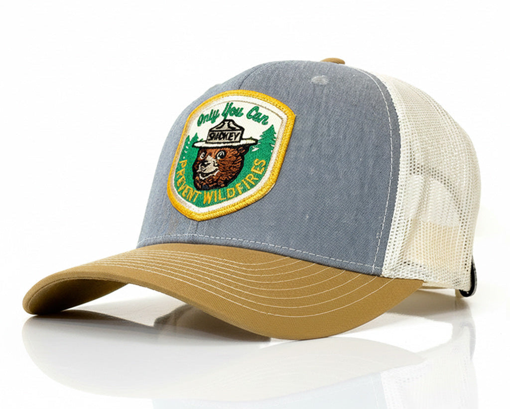 Trucker hat with a bear emblem and text on a white background