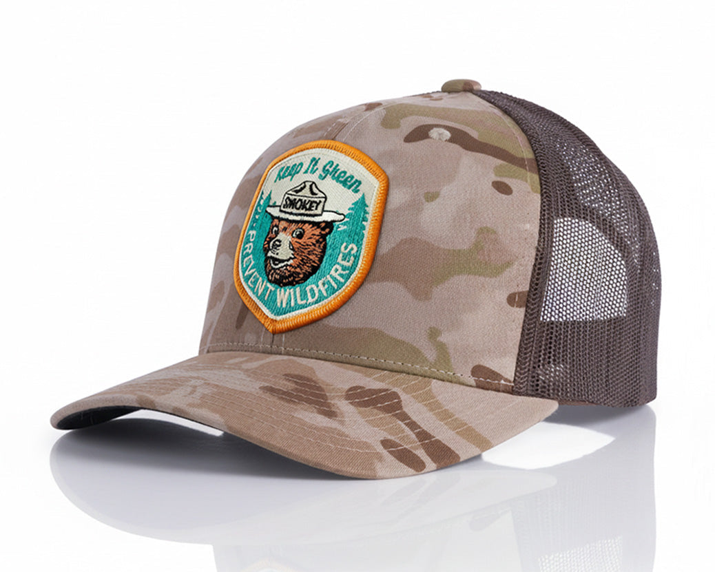 Camouflage baseball cap with a patch on a white background