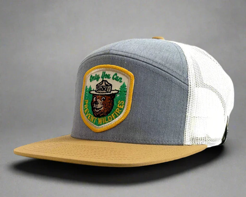 Trucker hat with a bear emblem and text on a white background