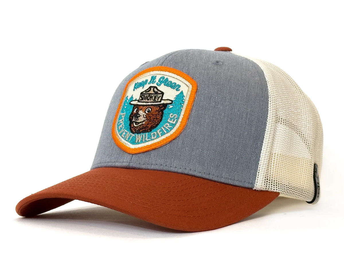 Trucker hat with a bear and hat graphic on a white background