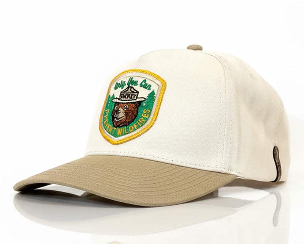 Beige cap with a patch on a white background