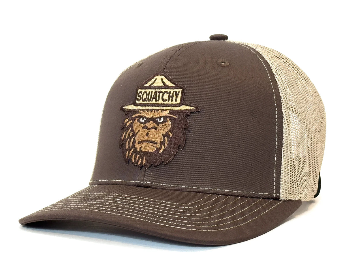 Brown and beige cap with a Sasquatch logo on a white background