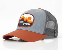 Gray and orange cap with Zion Utah patch on a white background