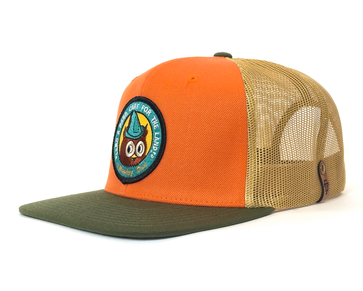 Orange and beige cap with a patch on a white background