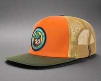 Orange and beige cap with a patch on a white background