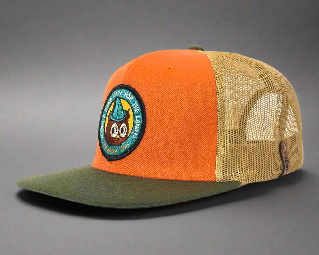 Orange and beige cap with a patch on a white background